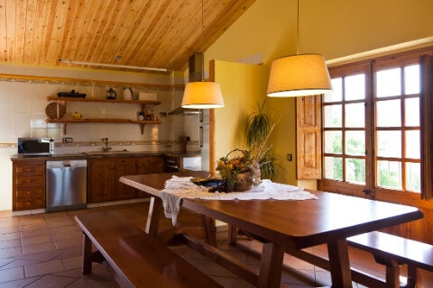 Dinning room, with the kitchen at the background